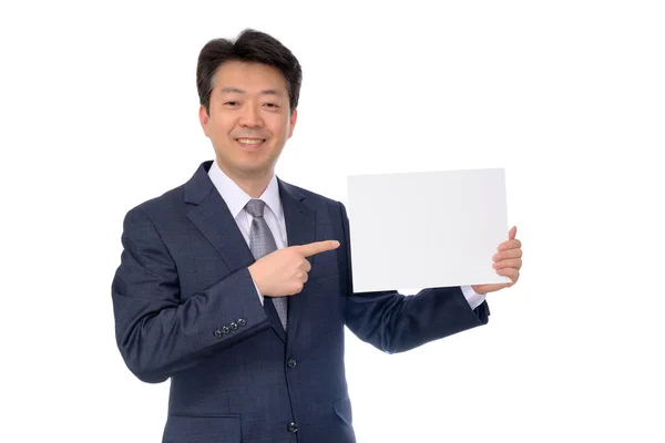 Portrait of Asian businessman holding blank message board. — Stock Photo, Image