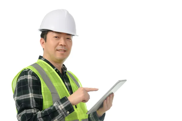 Middle-aged Asian engineer using tablet PC on a white background. — Stock Photo, Image