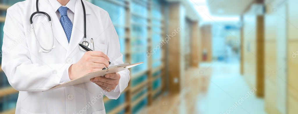 Cropped shot of a male doctor holding a medical chart at the hospital.