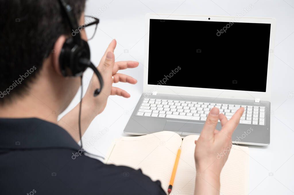 Online learning concept. A man who is receiving online learning using a laptop.