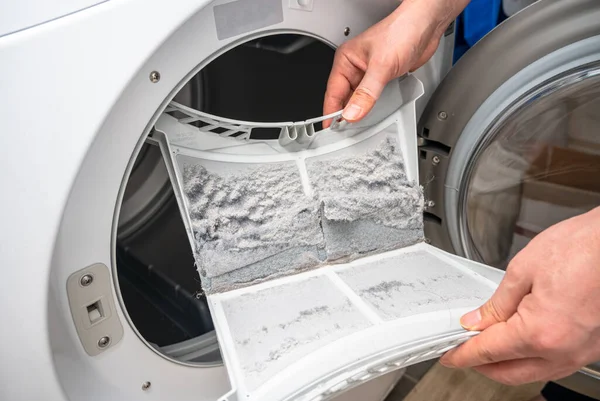 Dust and dirt trapped by the clothes dryer filter. — Stock Photo, Image