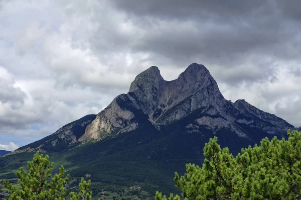Rocky and cloudy landscape of the Gresolet mountain. Pyrenees, Catalonia, Spain
