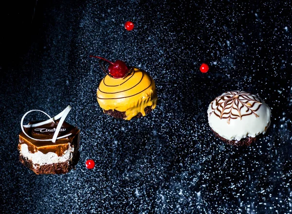 beautiful cakes on a black background