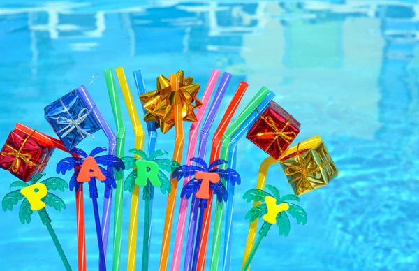 Party decorations and colored tubuleson. — Stock Photo, Image