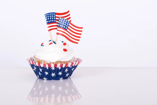 Patriotic cupcake with decorative American flags Royalty Free Stock Photos