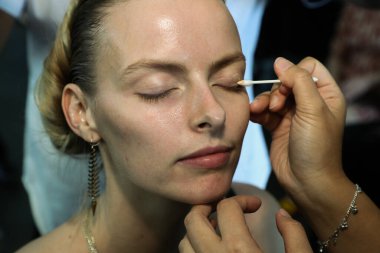 NEW YORK, NY - SEPTEMBER 08: A model getting ready backstage before the Custo Barcelona show during New York Fashion Week: The Shows at Pier 59 on September 8, 2018 in New York City. 