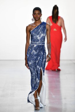 NEW YORK, NEW YORK - SEPTEMBER 05: A model walks the runway for Tadashi Shoji Spring/Summer 2020 during New York Fashion Week: The Shows at Gallery I at Spring Studios on September 05, 2019 in New York City. 