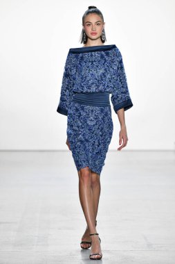 NEW YORK, NEW YORK - SEPTEMBER 05: A model walks the runway for Tadashi Shoji Spring/Summer 2020 during New York Fashion Week: The Shows at Gallery I at Spring Studios on September 05, 2019 in New York City. 