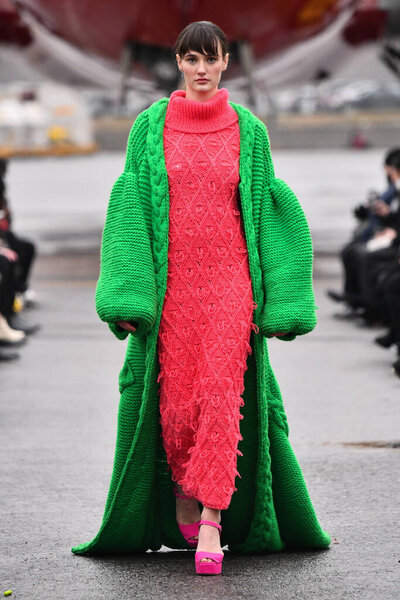 JAMAICA, NEW YORK - FEBRUARY 06: A model walks the runway for VUNGOC and SON during Jessica Minh Anhs Runway on Runway Winter Fashion Show at DHL hub JFK Airport on February 06, 2020 in NY 