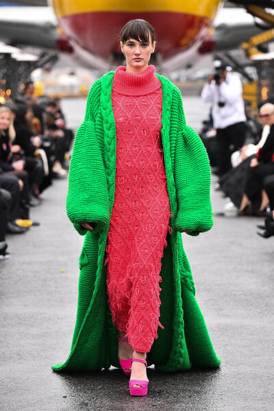 JAMAICA, NEW YORK - FEBRUARY 06: A model walks the runway for VUNGOC and SON during Jessica Minh Anhs Runway on Runway Winter Fashion Show at DHL hub JFK Airport on February 06, 2020 in NY 