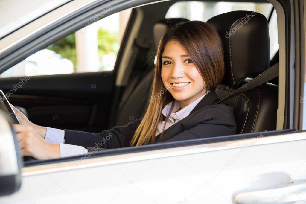 woman in a suit driving a car — Stock Photo © tonodiaz 129770536