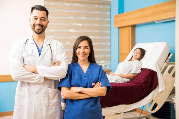 Doctor and a cute nurse standing — Stock Photo, Image