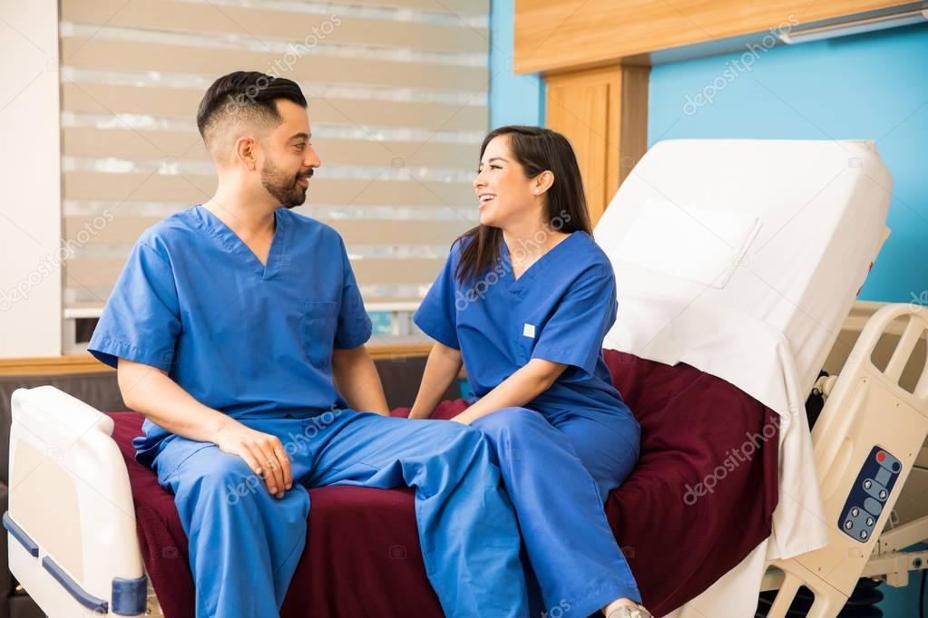 Couple of nurses relaxing in a hospital room