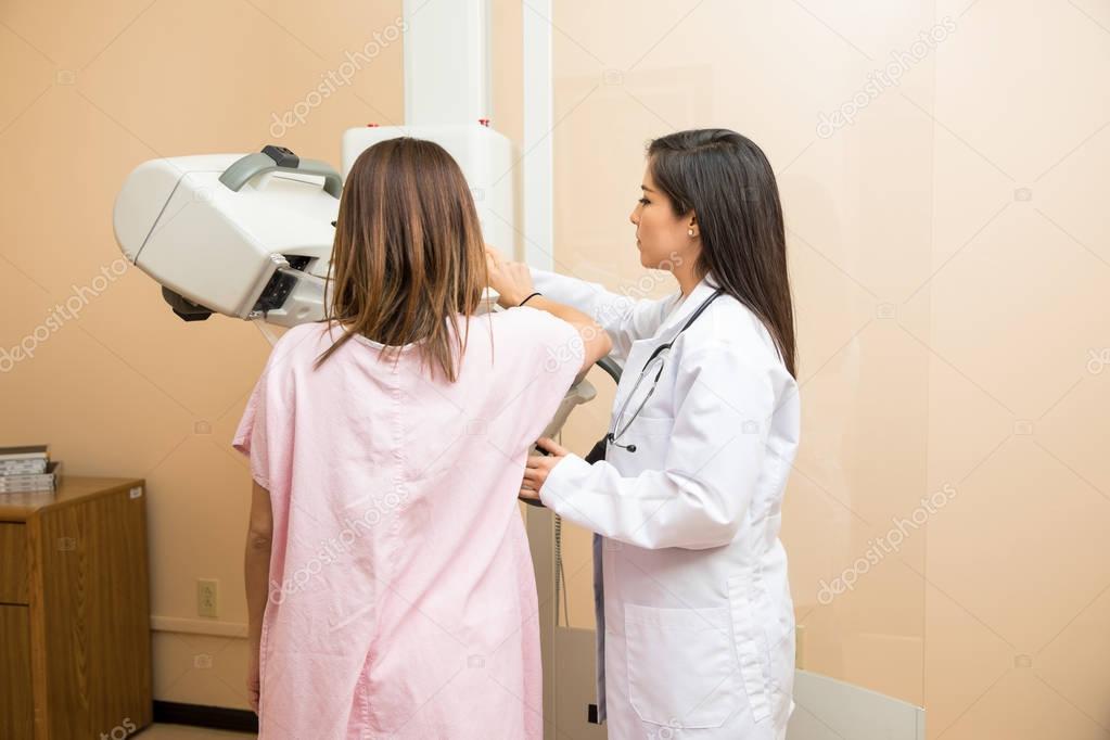 Doctor and patient during mammogram