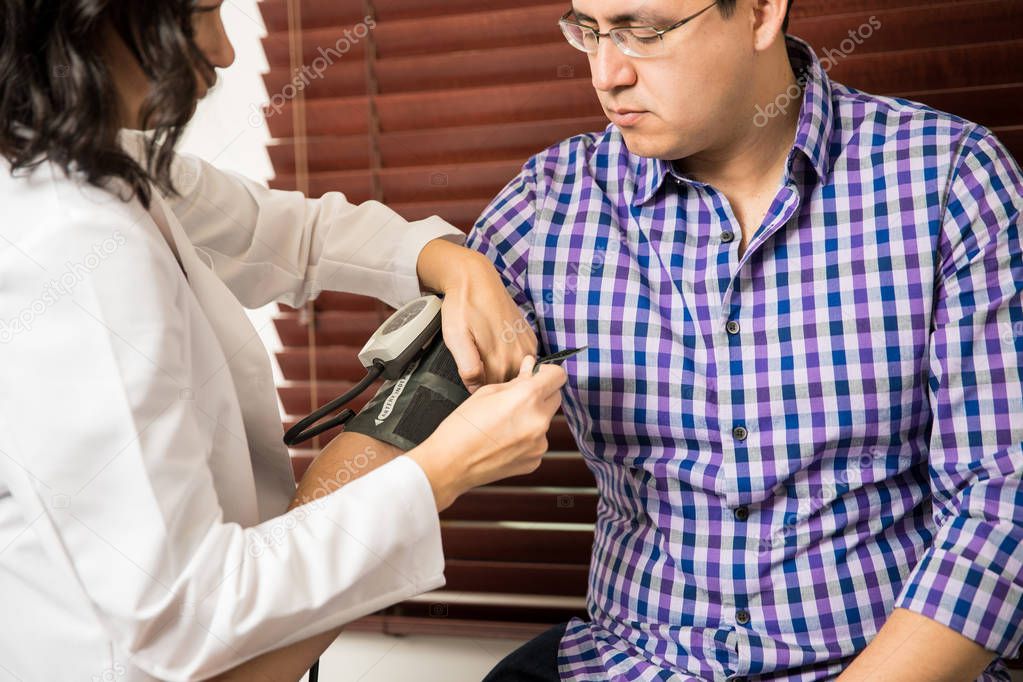 doctor using pressure gauge