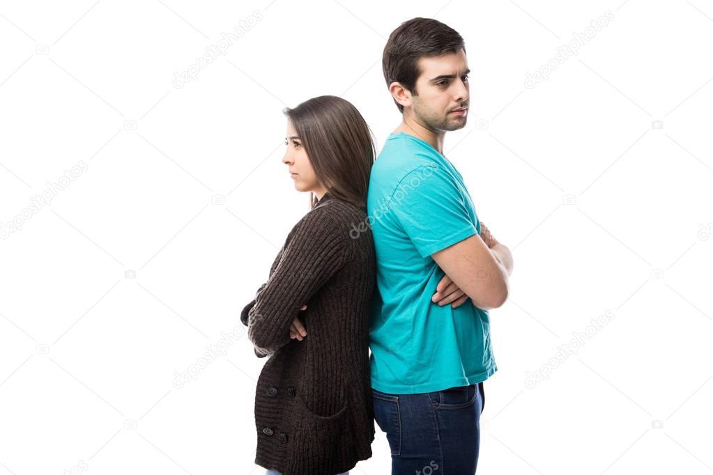 couple standing back to back