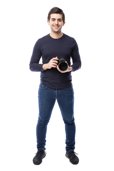 Photographer holding camera — Stock Photo, Image