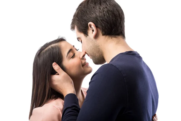 Young man kissing girlfriend Stock Picture