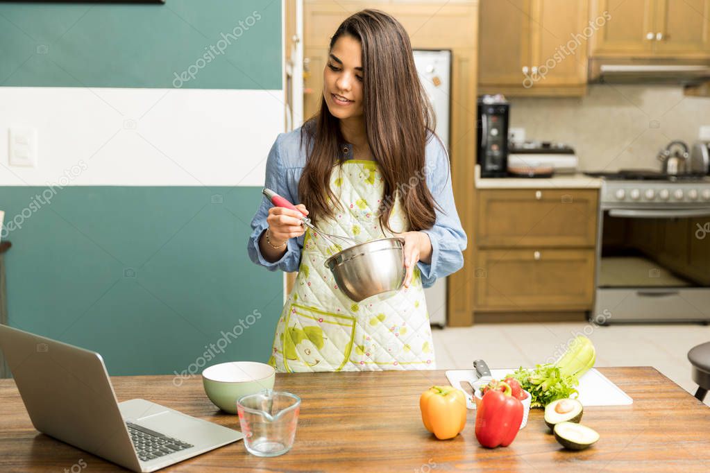 Woman following a cooking tutorial