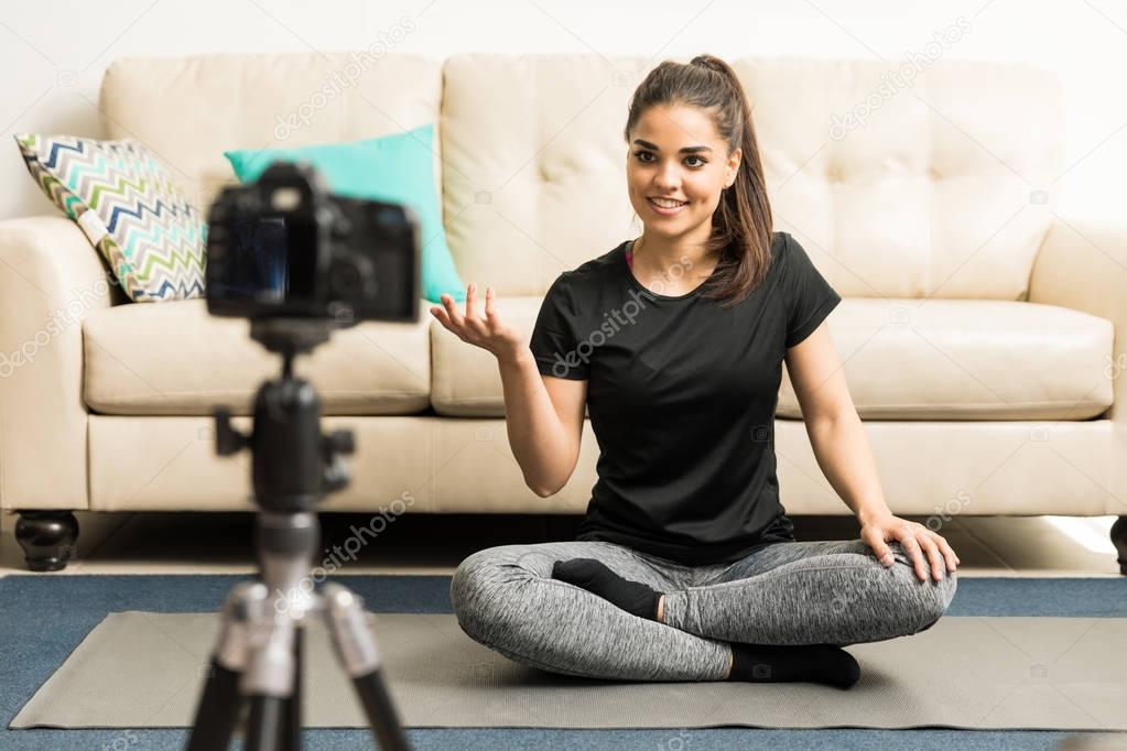 Yoga instructor recording a video