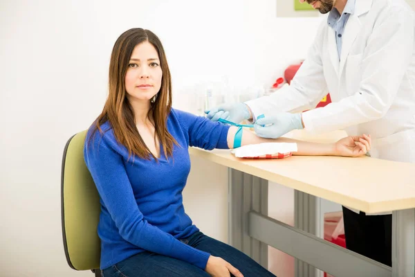 Nervous patient getting a blood test — Stock Photo, Image