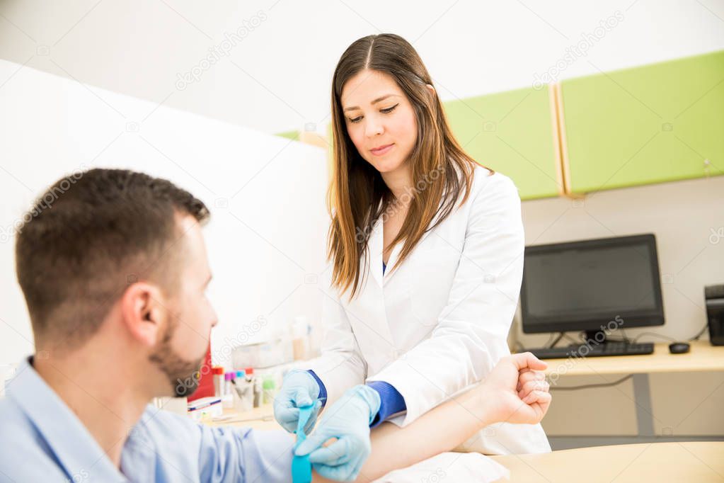 Female doctor doing blood analysis