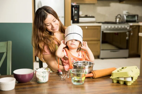 Toddler playing with cooking hat — Stock Photo, Image