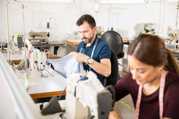 Workers sewing on a textile factory