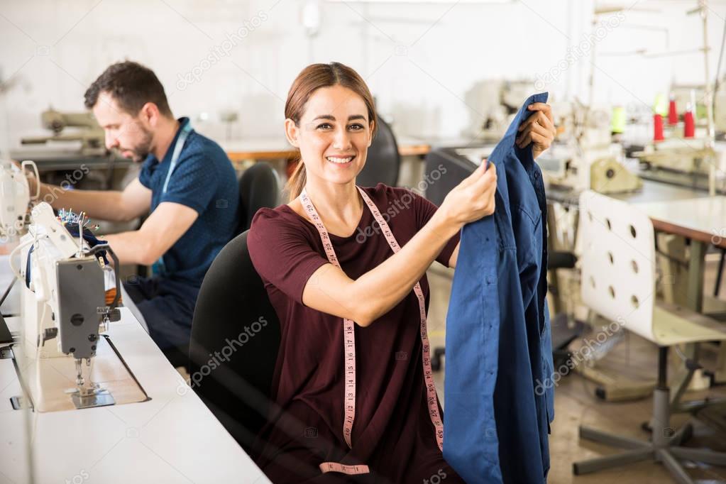 Female tailor enjoying her work