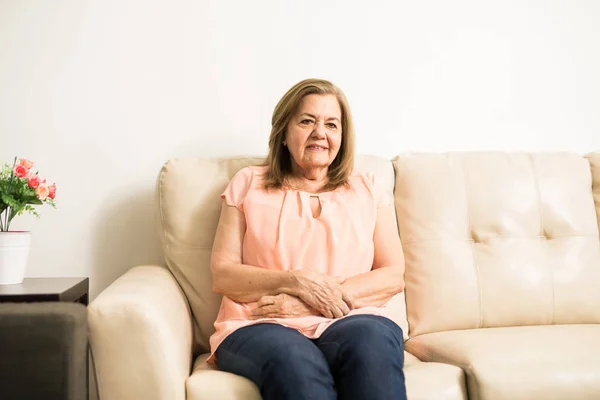 Woman rubbing her belly — Stock Photo, Image