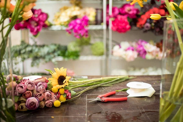 Florist's workshop with a bunch of natural flowers