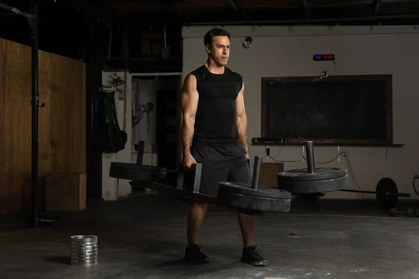 Athletic man in a cross-training gym — Stock Photo, Image