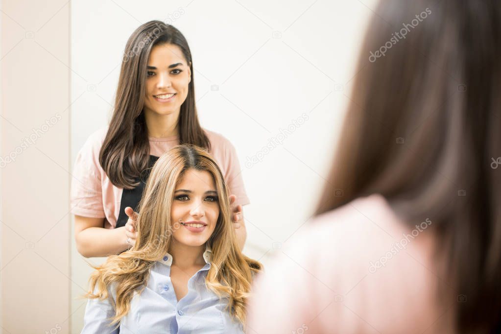hairstylist giving finishing touches
