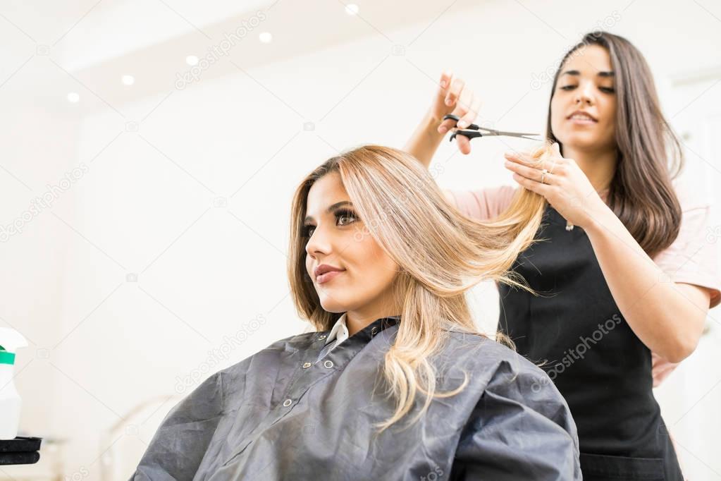 brunette working as hairdresser