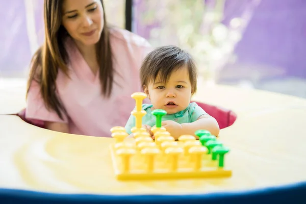 Baby exploring and playing at school — Stock Photo, Image
