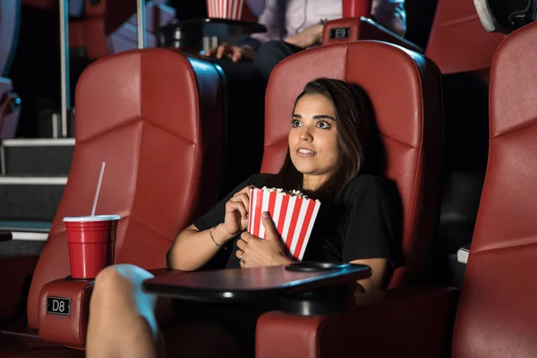 Scared woman at cinema — Stock Photo, Image