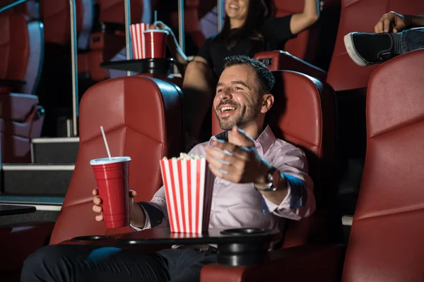 Laughing watching movie in cinema — Stock Photo, Image