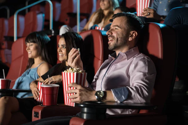 People enjoying movie in cinema