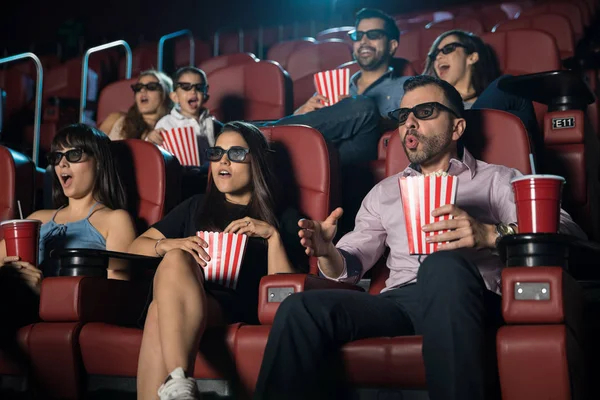 Surprised crowd watching 3d movie — Stock Photo, Image