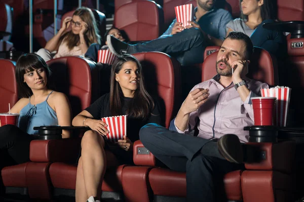 Man talking on phone at cinema — Stock Photo, Image