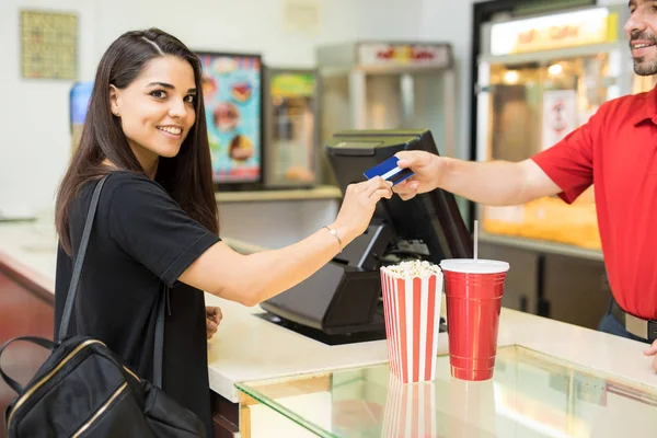 Woman buying snacks in movies — Stock Photo, Image