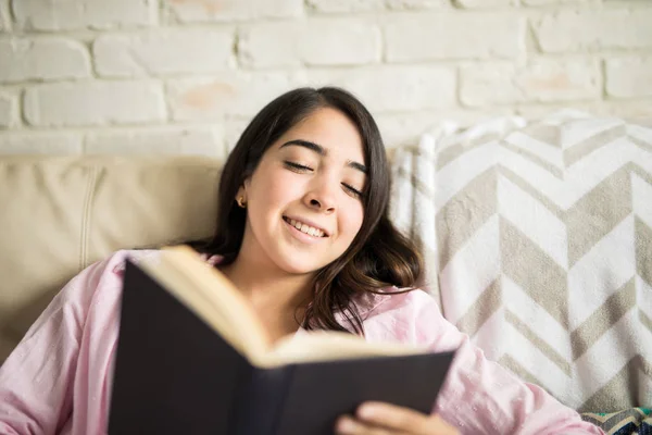 Young woman on cozy sofa — Stock Photo, Image