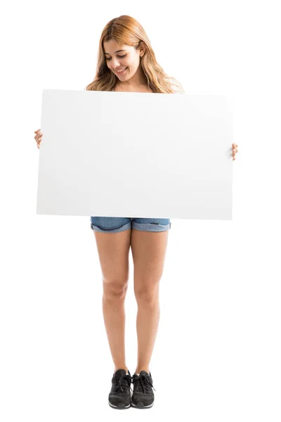 Hispanic woman with white sign — Stock Photo, Image