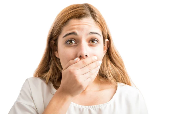 Cute woman covering her mouth Stock Photo