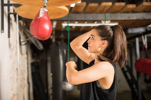Woman punching a speed bag