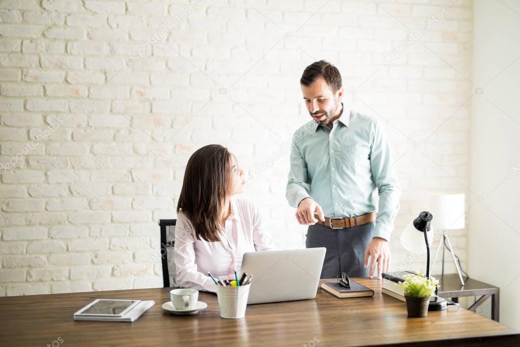 Boss giving feedback to new employee