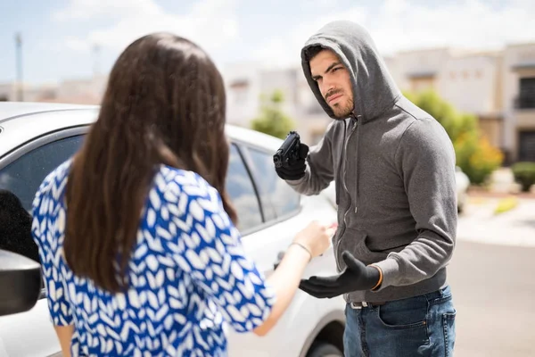 Stealing a car at gunpoint