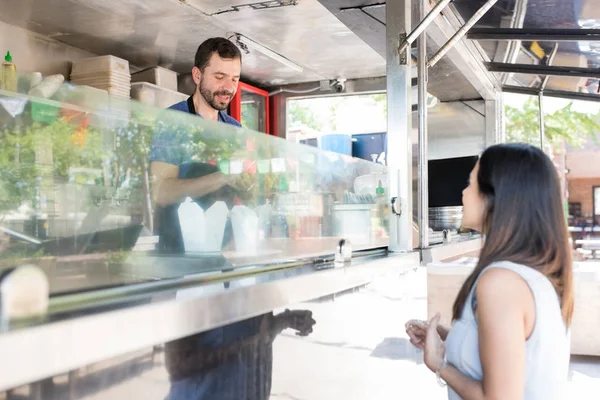 Woman ordering food in a truck — Stock Photo, Image