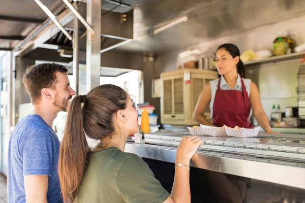 Customers making line in a food truck — Stock Photo, Image