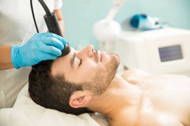 Man getting a radiofrequency facial clipart